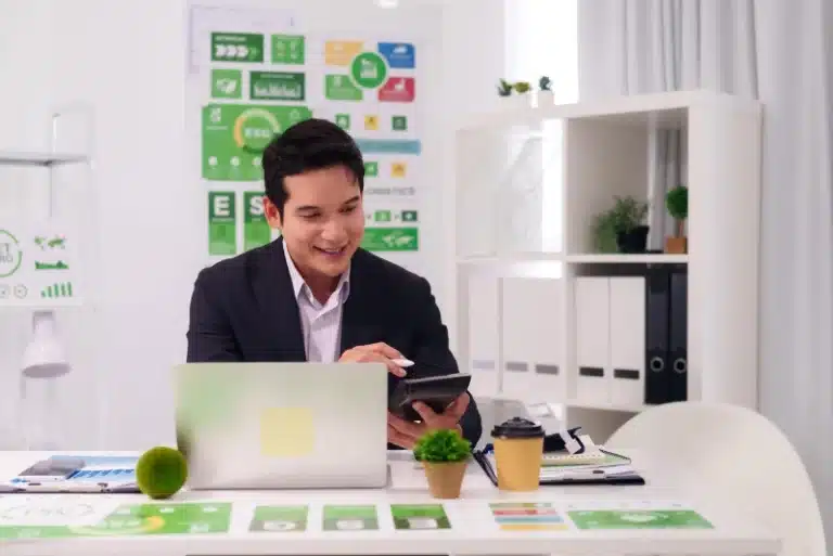 Roofing business professional reviewing digital marketing data at a desk, representing how roofing SEO services help contractors improve online visibility, attract local leads, and grow their business.